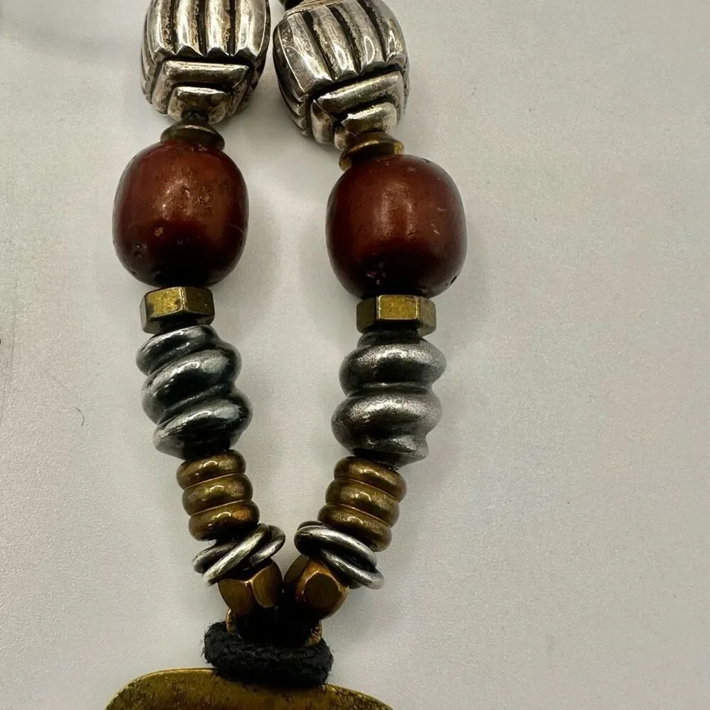 Baer SF sterling silver and brass pendant necklace on black cord